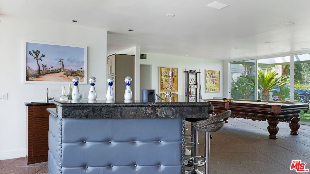 70375 Calico Road Rancho Mirage, CA 92270 - Photo 8 of 46 a living room with furniture a piano and a large window