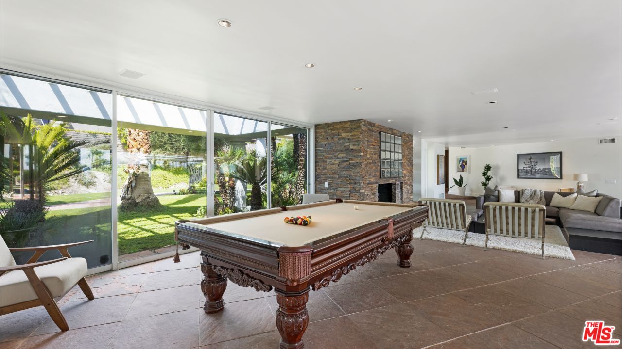70375 Calico Road Rancho Mirage, CA 92270 - Photo 9 of 46 a living room with furniture a table and a large window