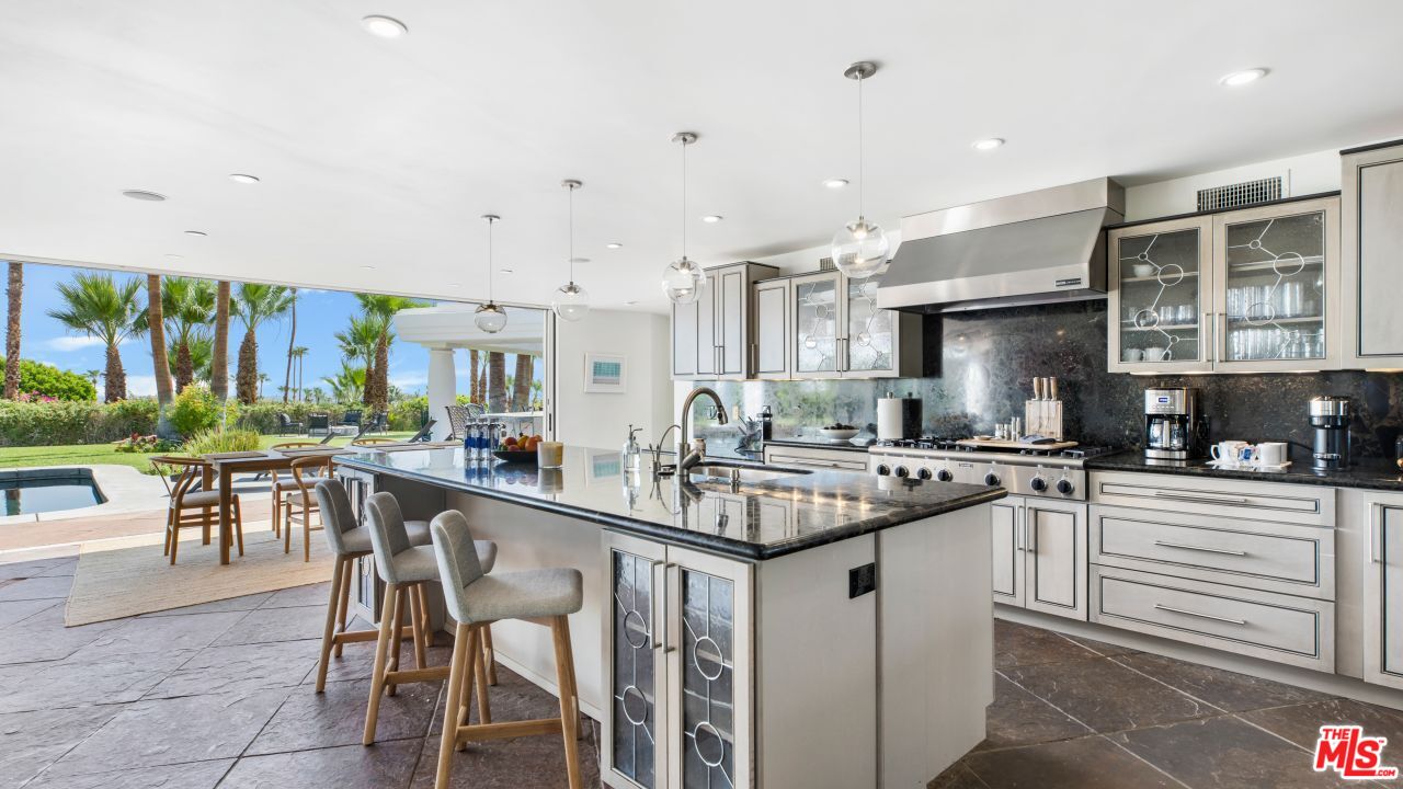 70375 Calico Road Rancho Mirage, CA 92270 - Photo 10 of 46 a kitchen with lots of counter top space and appliances