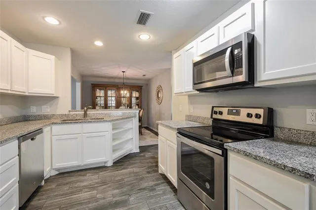 a kitchen with a stove and a microwave