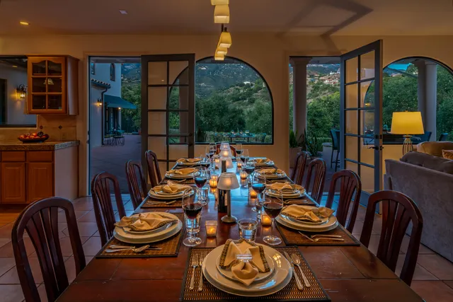 a spacious bedroom with a bed and a painting on the wall