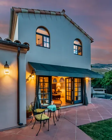 a view of a room with a table and a potted plant