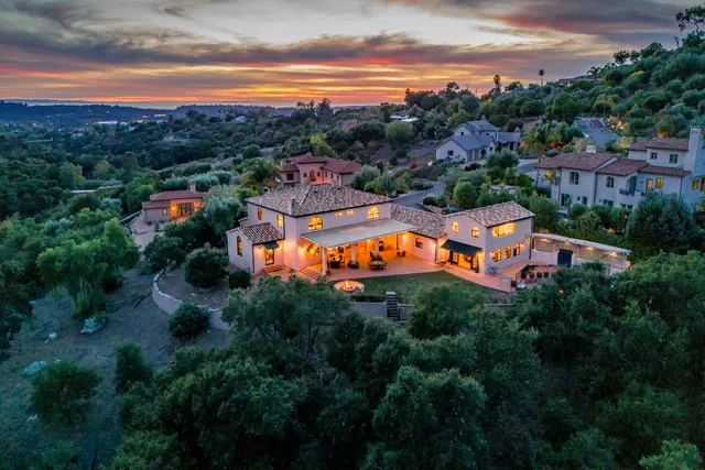 an aerial view of a house with a garden