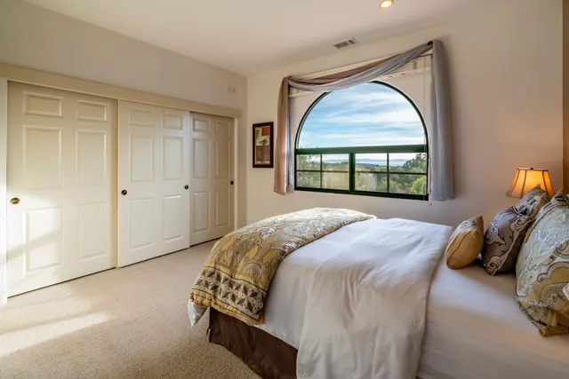 a living room with furniture and a view