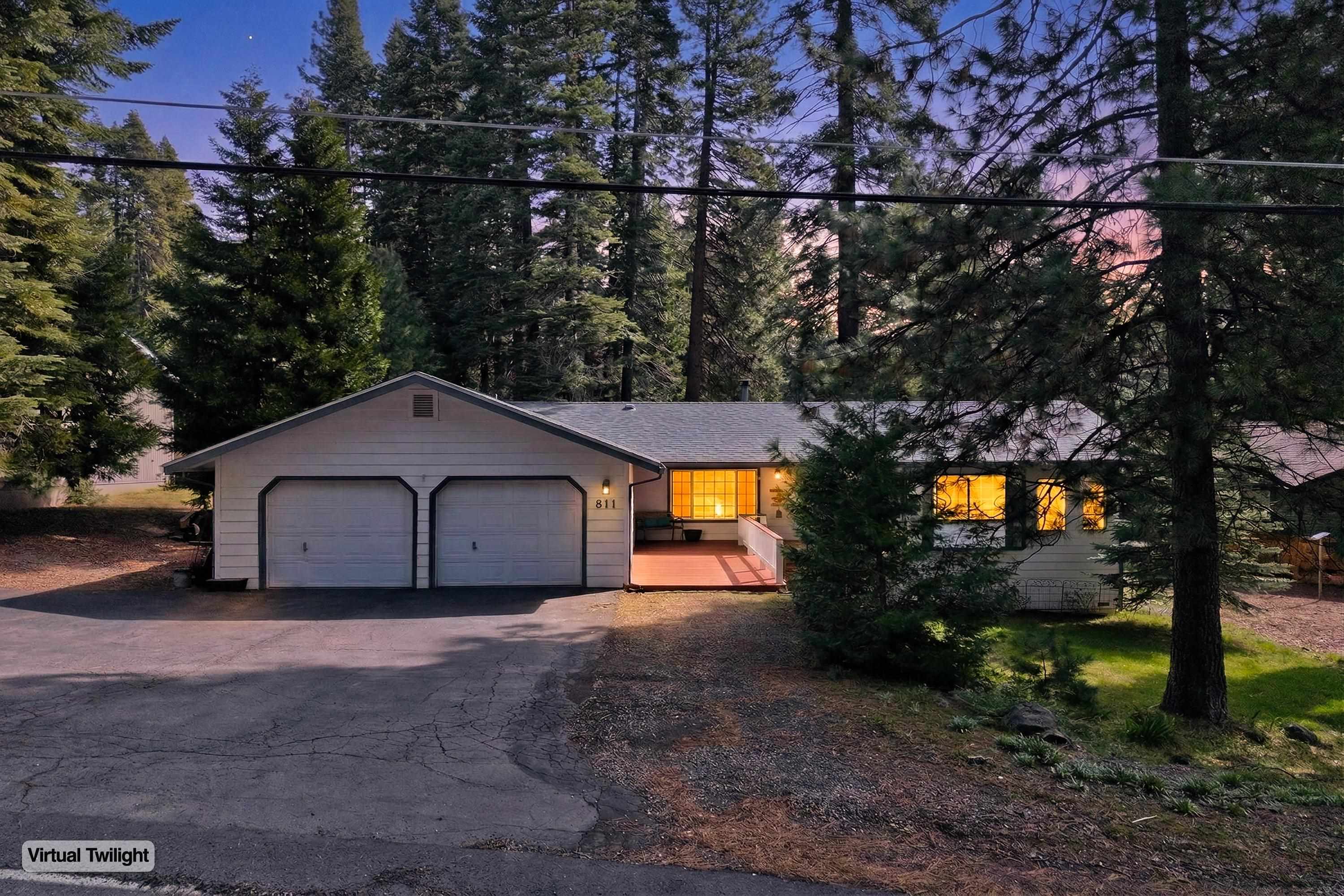 811 Golf Club Road Lake Almanor, CA 96137 - Photo 2 of 42 a view of a house with a yard and a large tree