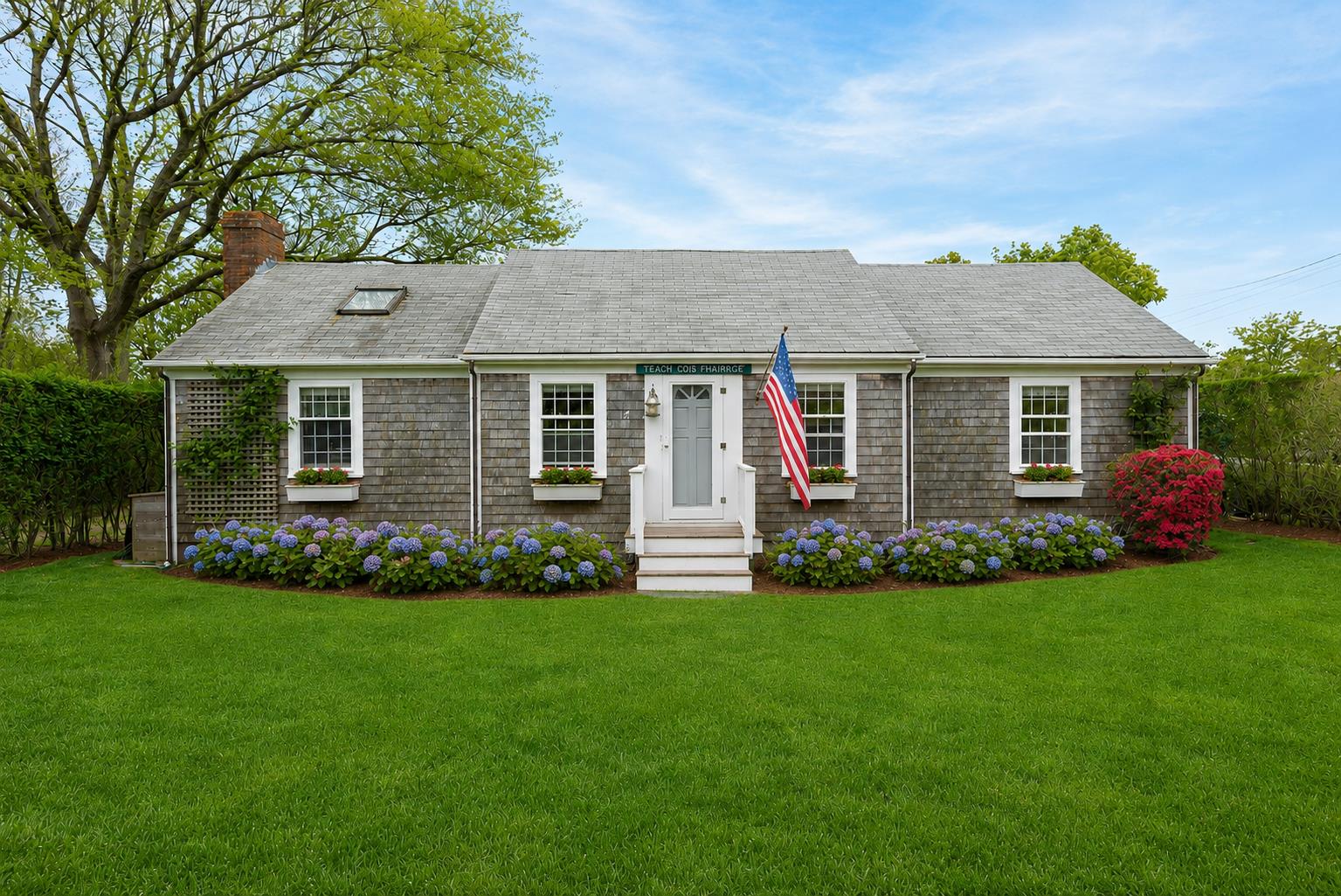 a front view of a house with a garden
