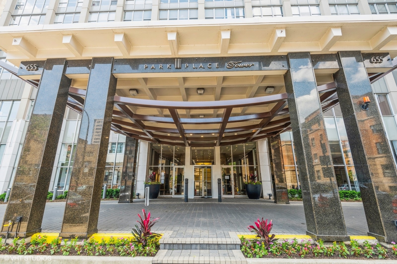 655 West Irving Park Road, Unit 1911 Chicago, IL 60613 - Photo 1 of 27 a front view of a building with street