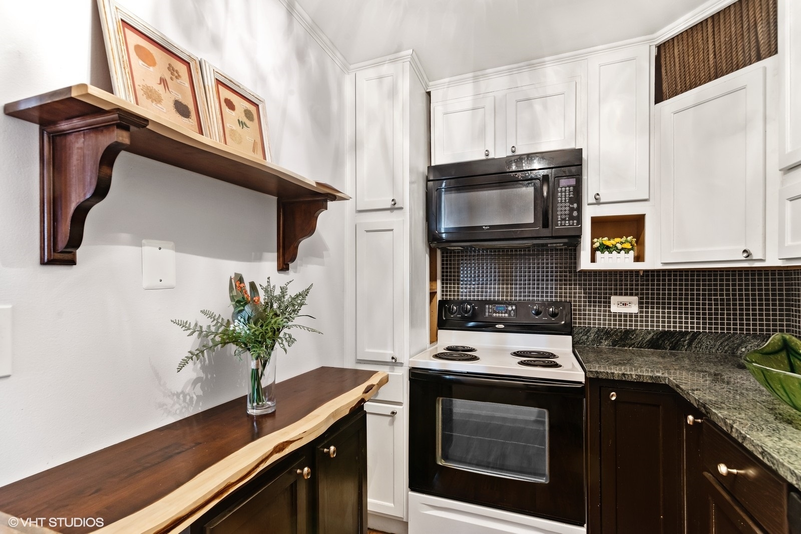 655 West Irving Park Road, Unit 1911 Chicago, IL 60613 - Photo 11 of 27 a kitchen with granite countertop a stove and a sink