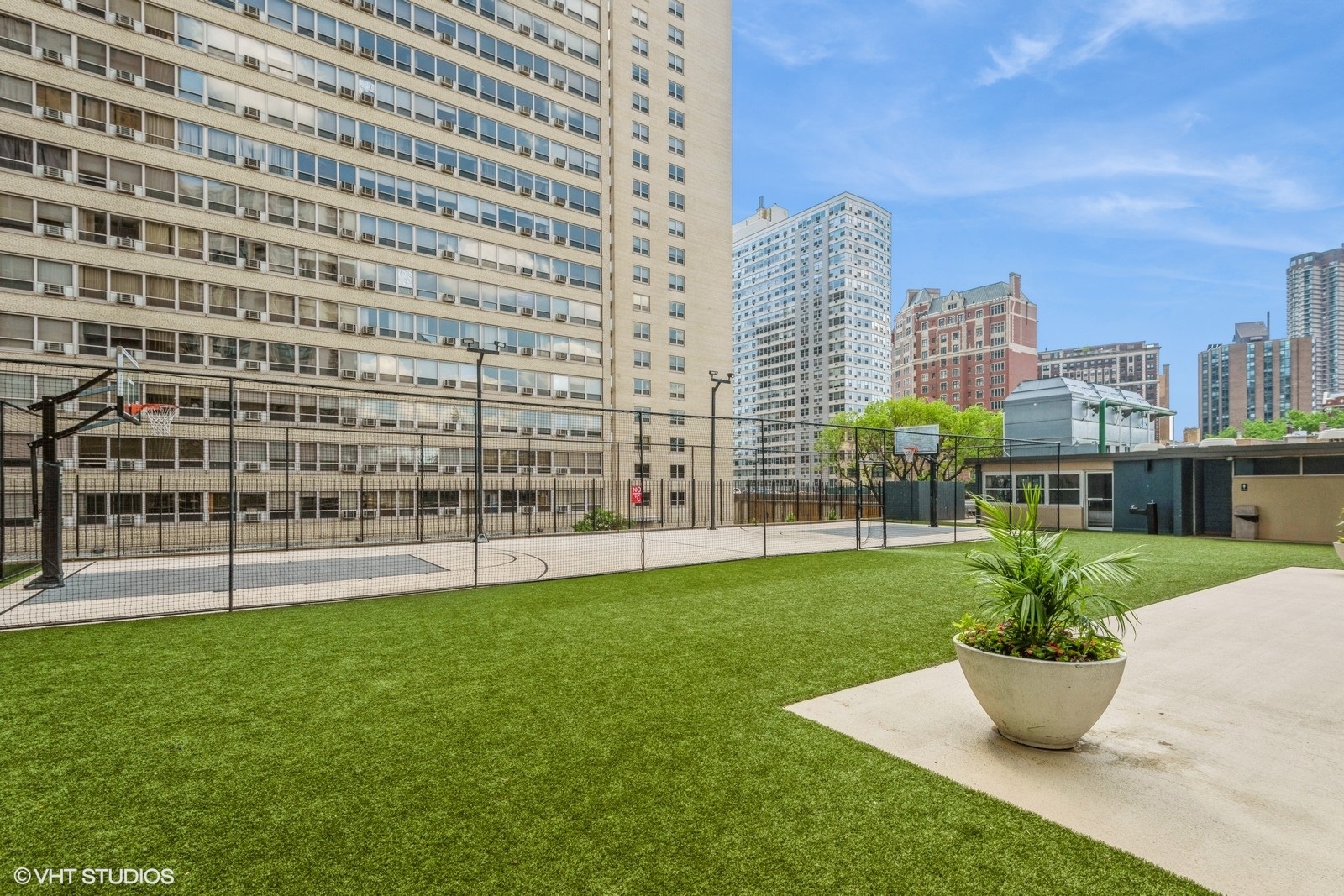 655 West Irving Park Road, Unit 1911 Chicago, IL 60613 - Photo 24 of 27 a view of a city with tall buildings and a big yard
