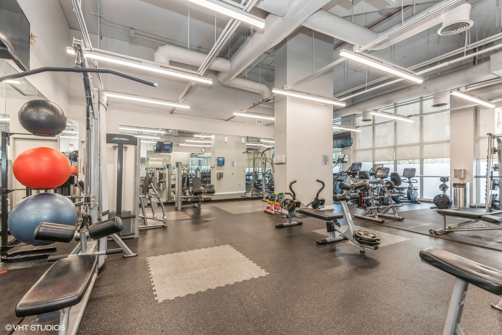 655 West Irving Park Road, Unit 1911 Chicago, IL 60613 - Photo 25 of 27 a view of a room with gym equipment