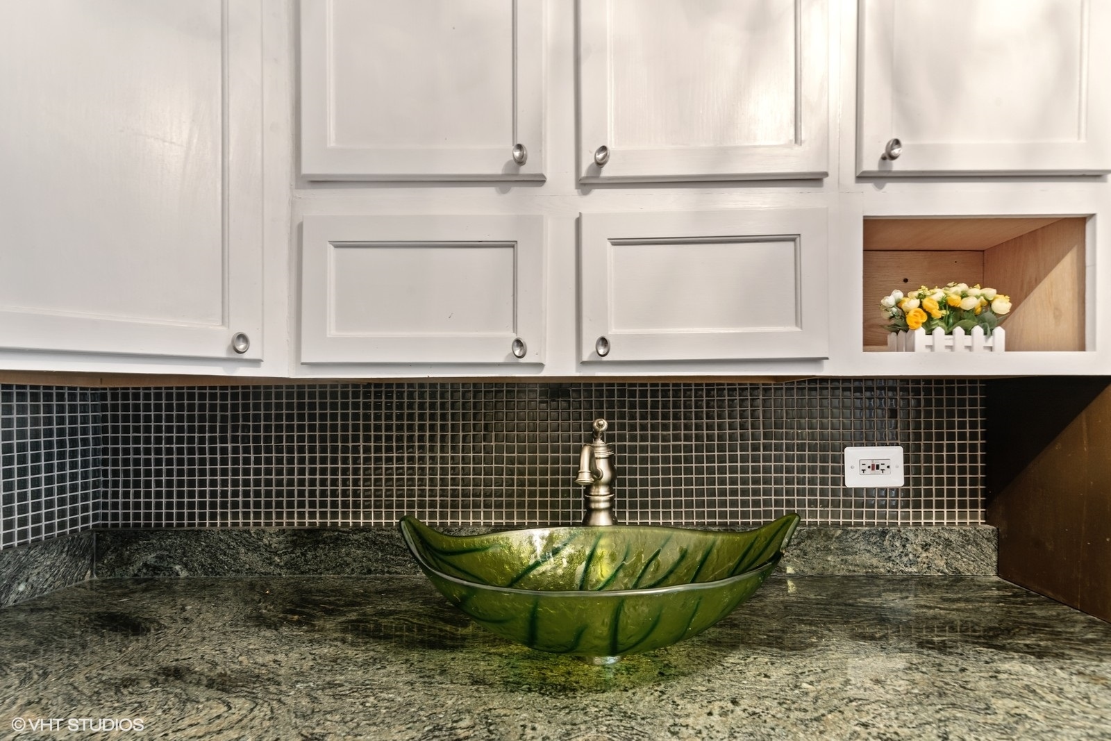 655 West Irving Park Road, Unit 1911 Chicago, IL 60613 - Photo 10 of 27 a kitchen with a sink and a stove