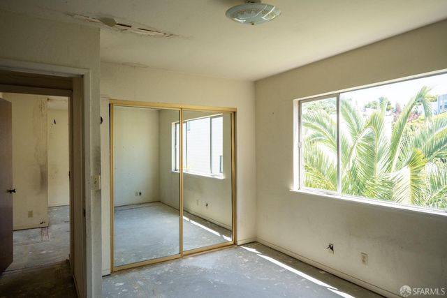 a view of empty room with windows