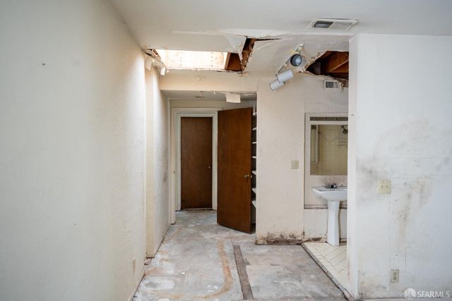a view of an empty room with empty shelves