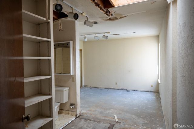 an empty room with a bathroom