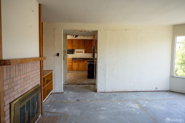 a view of an empty room and window