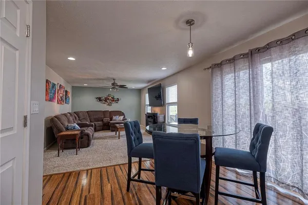 a view of a dining room with furniture window and outside view