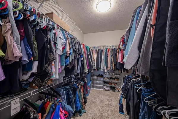 a bedroom with a large bed and a large window