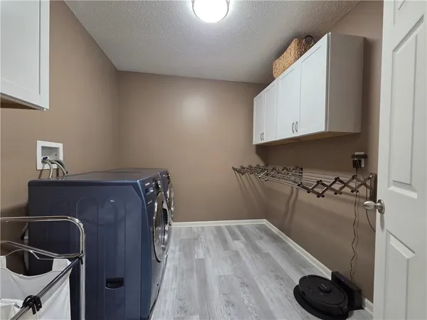 a view of a house with a yard and deck