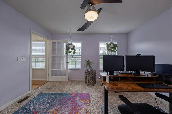 a workspace with furniture and window