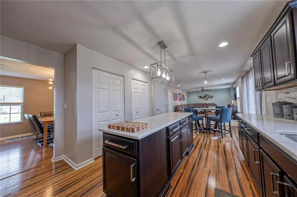 a view of a kitchen with stainless steel appliances granite countertop lots of counter top space