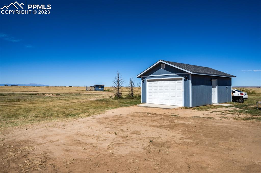 33220 Fossinger Road Yoder, CO 80864 - Photo 21 of 21 a view of an empty room with kitchen and a window