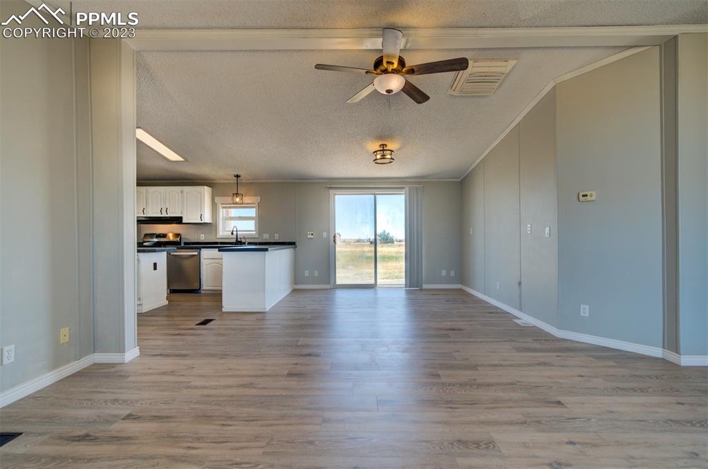 33220 Fossinger Road Yoder, CO 80864 - Photo 4 of 21 a view of a kitchen with a sink stainless steel appliances and cabinets