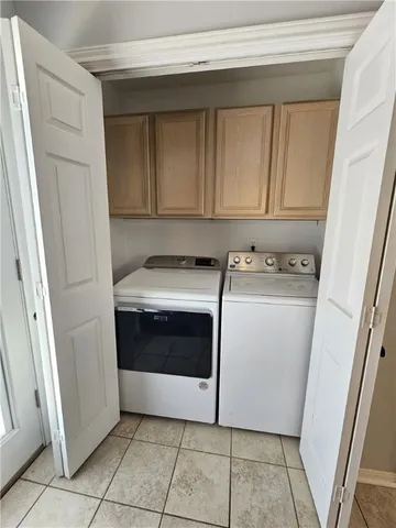 a utility room with washer and dryer