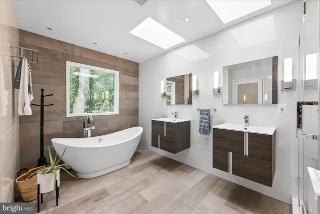 a white bath tub sitting in a bathroom
