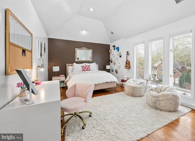 a spacious bathroom with a granite countertop sink and a mirror