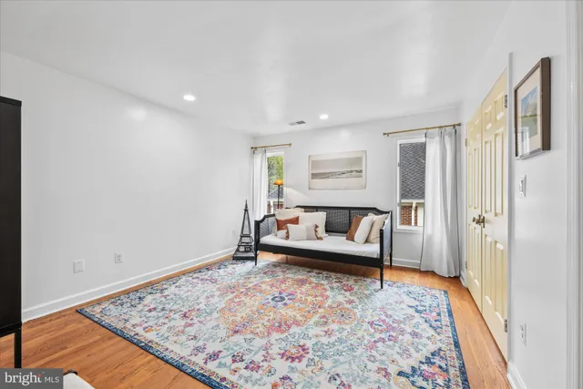 a bathroom with a double vanity sink mirror bathtub and toilet