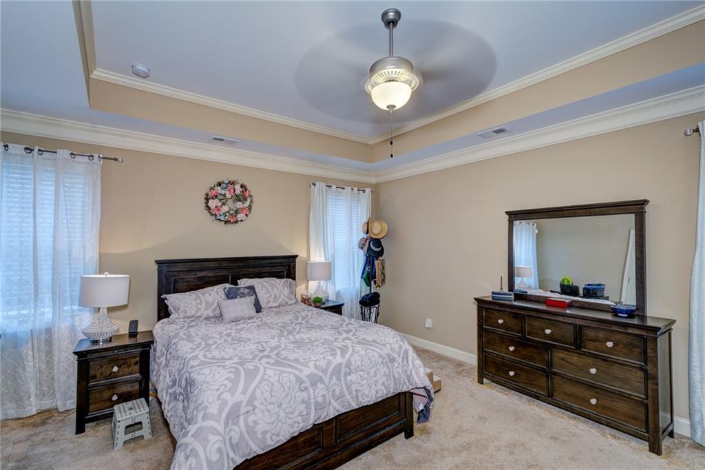 2443 Barrett Preserve Court Marietta, GA 30064 - Photo 13 of 46 a bedroom with a bed and a dresser