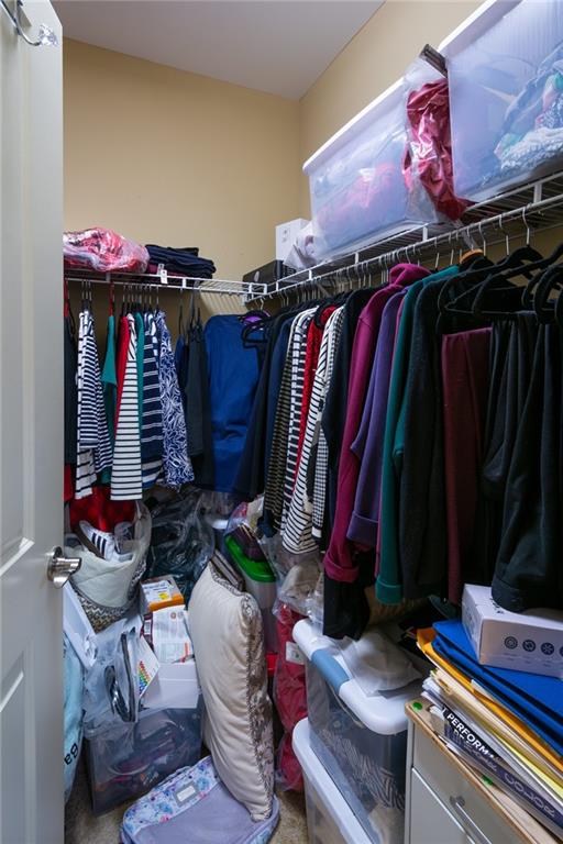 2443 Barrett Preserve Court Marietta, GA 30064 - Photo 20 of 46 a view of walk in closet with clothes and shoes