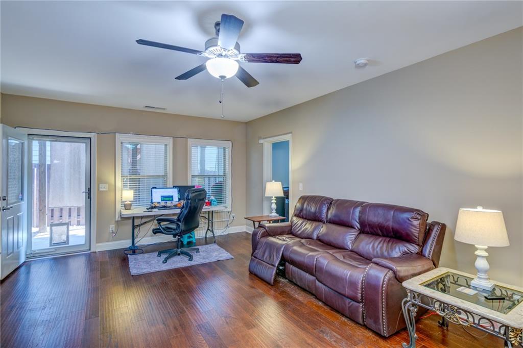 2443 Barrett Preserve Court Marietta, GA 30064 - Photo 22 of 46 a living room with furniture and wooden floor