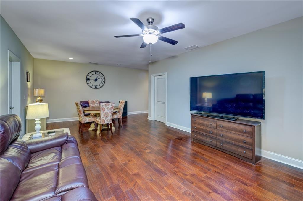 2443 Barrett Preserve Court Marietta, GA 30064 - Photo 23 of 46 a living room with furniture and a flat screen tv