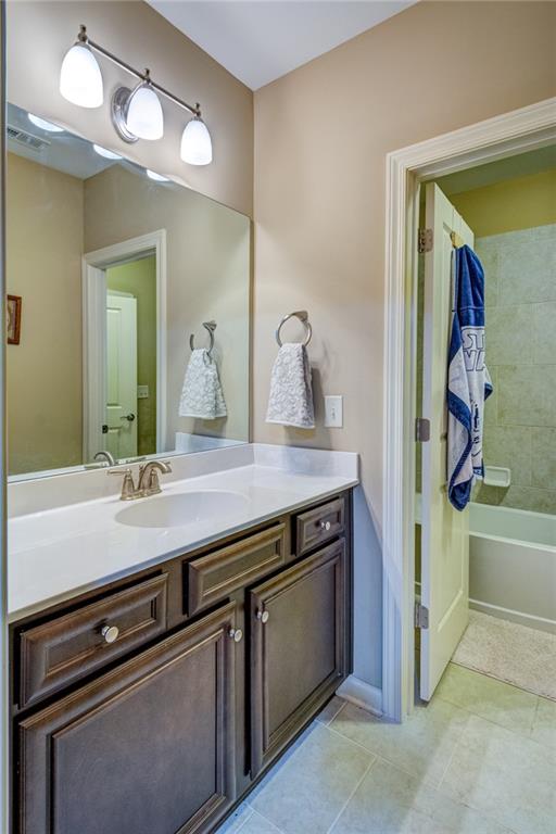 2443 Barrett Preserve Court Marietta, GA 30064 - Photo 28 of 46 a bathroom with a sink a vanity and a mirror