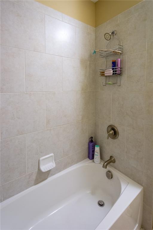 2443 Barrett Preserve Court Marietta, GA 30064 - Photo 29 of 46 a bathroom with a tub
