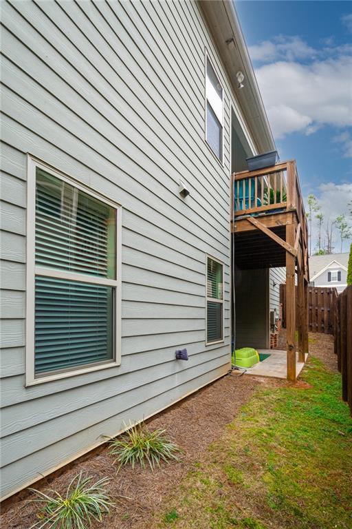 2443 Barrett Preserve Court Marietta, GA 30064 - Photo 33 of 46 a view of a house with a small yard and a large tree
