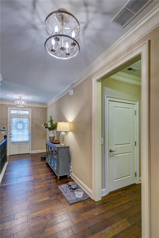 2443 Barrett Preserve Court Marietta, GA 30064 - Photo 35 of 46 an empty room with wooden floor mirror and windows