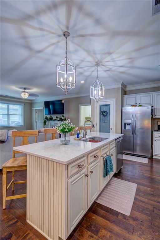 2443 Barrett Preserve Court Marietta, GA 30064 - Photo 5 of 46 a kitchen with stainless steel appliances a chandelier and refrigerator