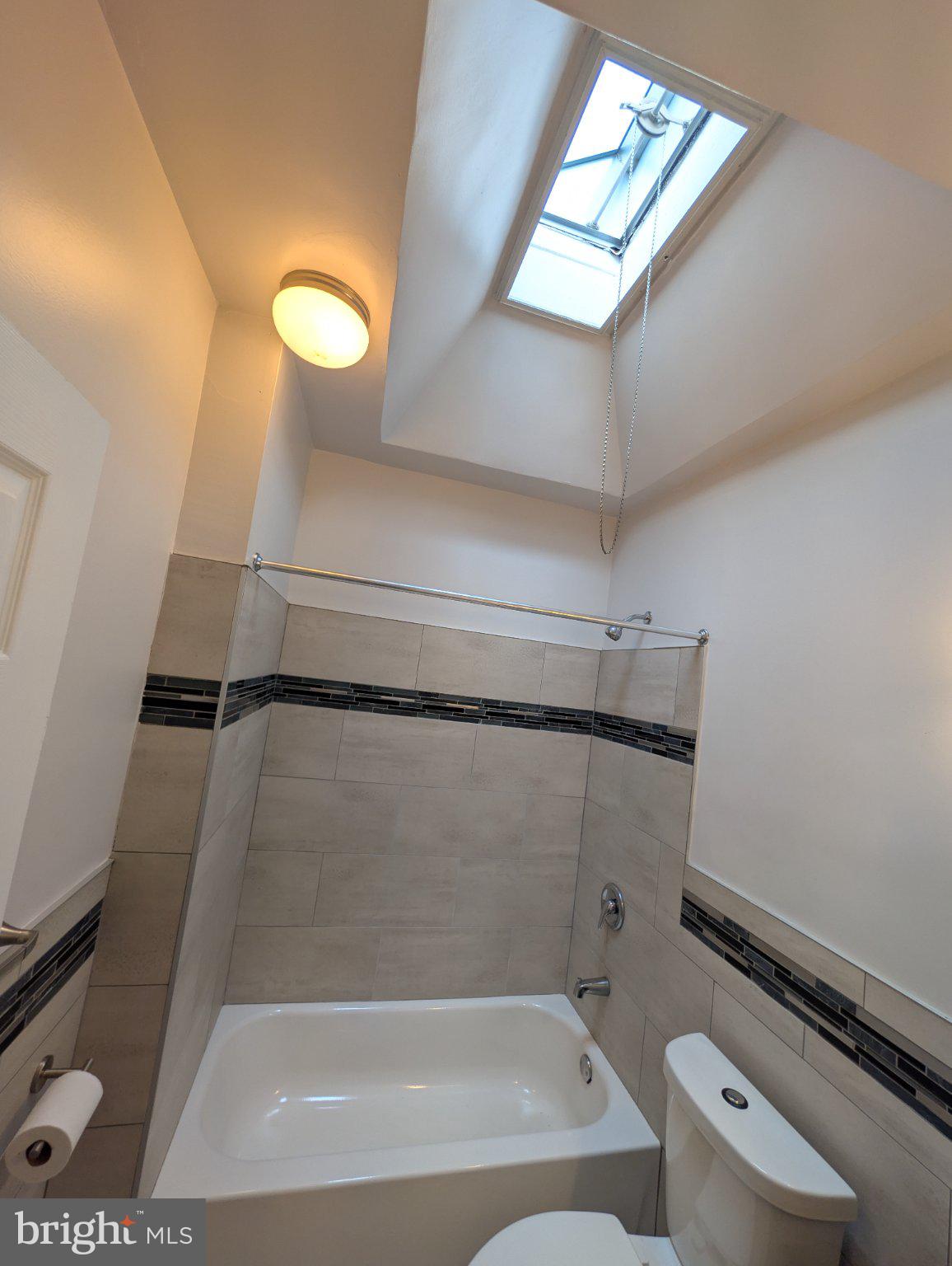 5933 Trinity Street Philadelphia, PA 19143 - Photo 19 of 21 Bright bathroom with skylight charm.