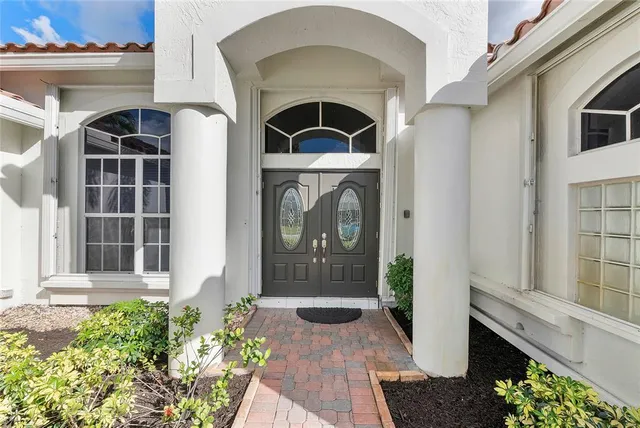 a front view of a house with large windows