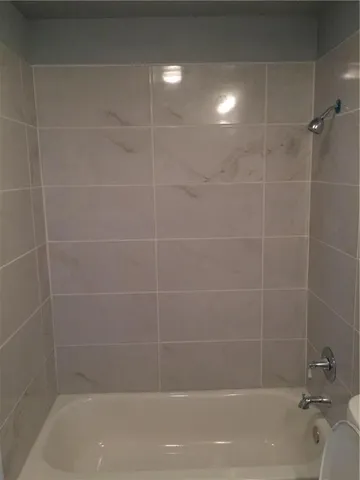 a close up of a bathtub in a bathroom