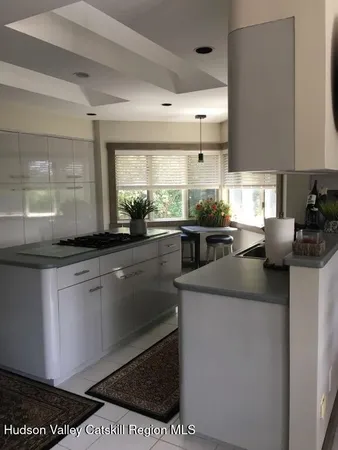 a kitchen with a sink and appliances