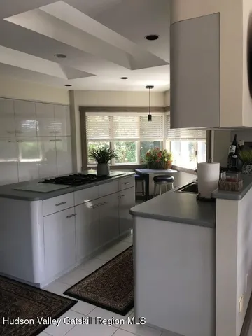 a kitchen with a sink and appliances