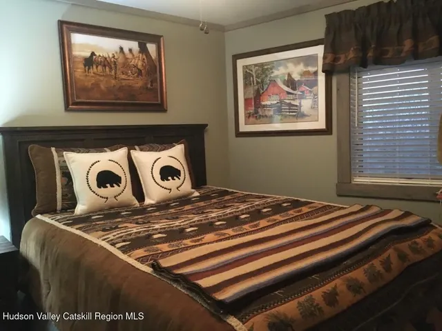 a front view of a house with a bed