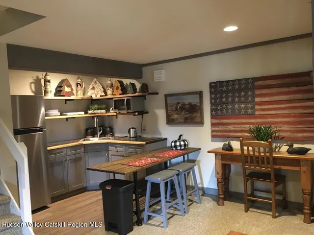 a room with furniture a rug and a window