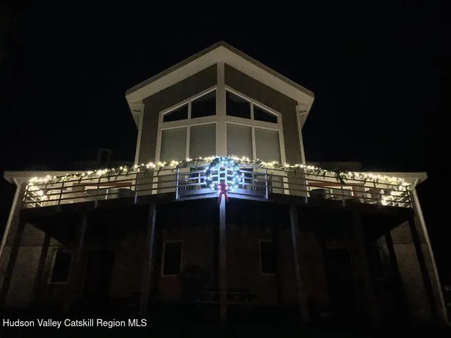 a view of a house with table and chairs
