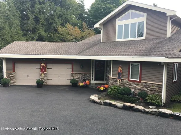 a view of a car park in front of house