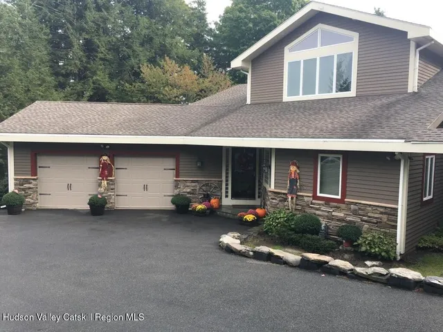 a view of a car park in front of house