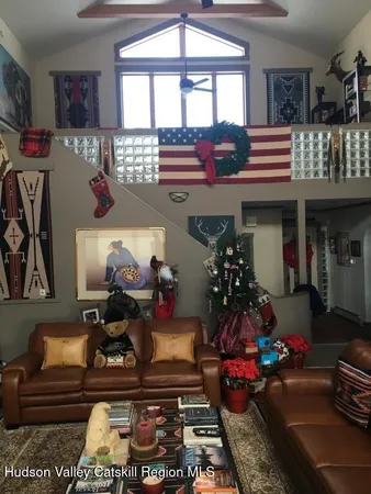 a living room with lots of furniture and a rug